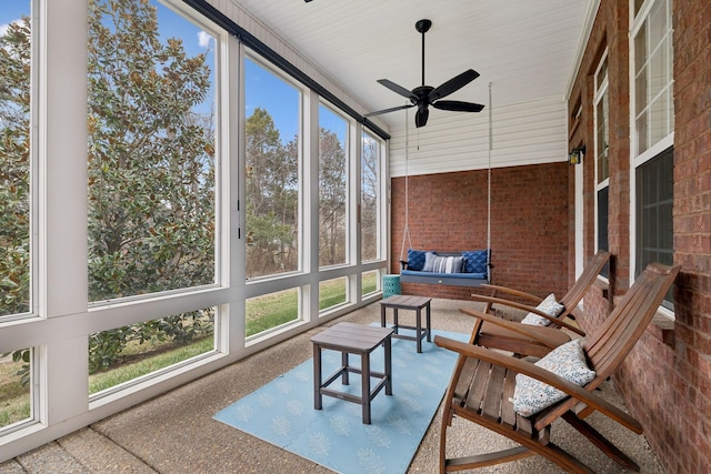 sunroom featuring ceiling fan and a healthy amount of sunlight