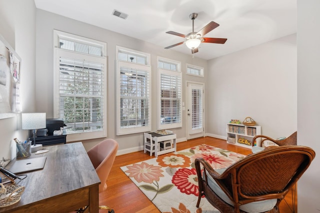 office featuring ceiling fan and light wood-type flooring