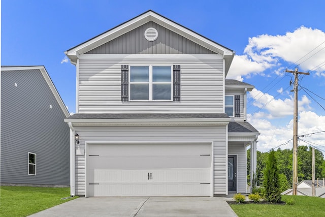 front facade featuring a garage and a front yard