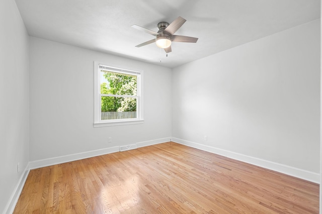 unfurnished room featuring ceiling fan and light wood-type flooring