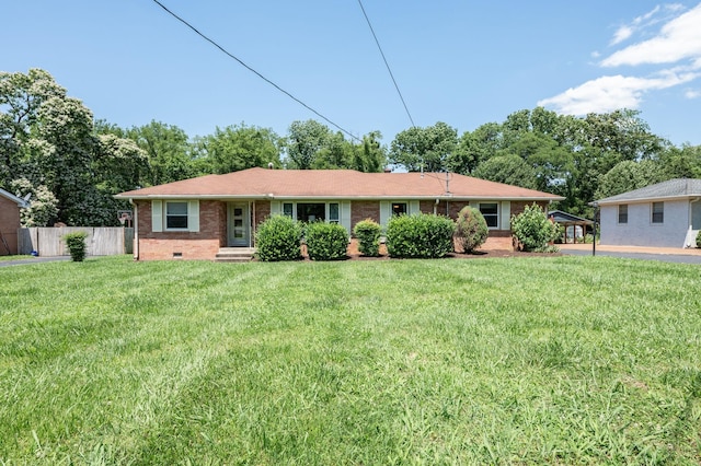 ranch-style home with a front lawn