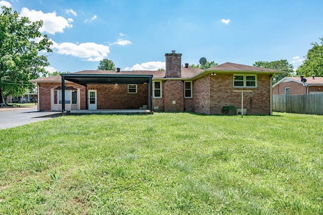 back of house with a yard