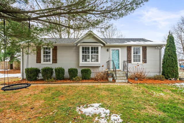 ranch-style home featuring a front lawn