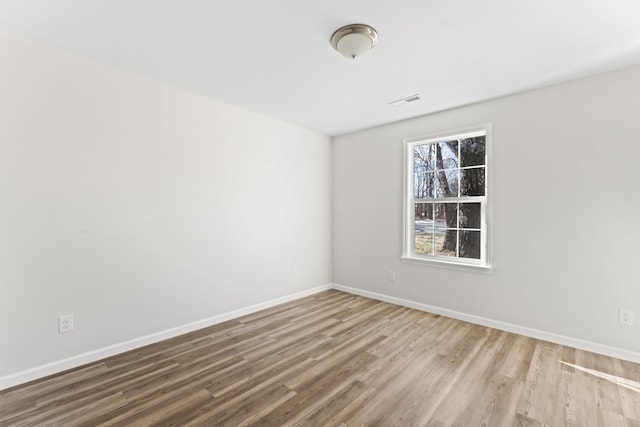 unfurnished room featuring hardwood / wood-style floors