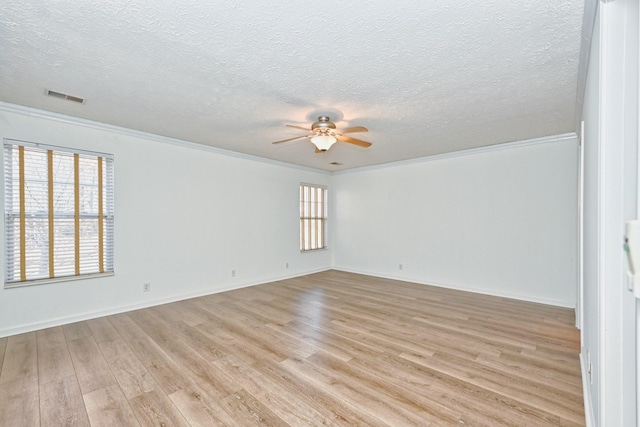 unfurnished room with a textured ceiling, ceiling fan, light wood-type flooring, and crown molding