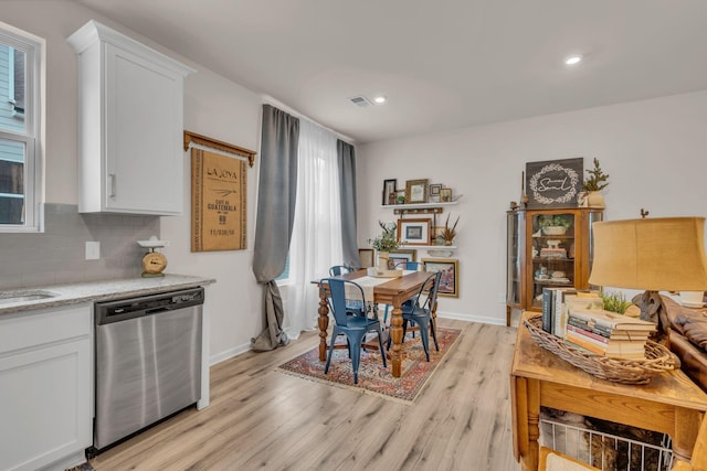 dining area featuring light hardwood / wood-style flooring and sink