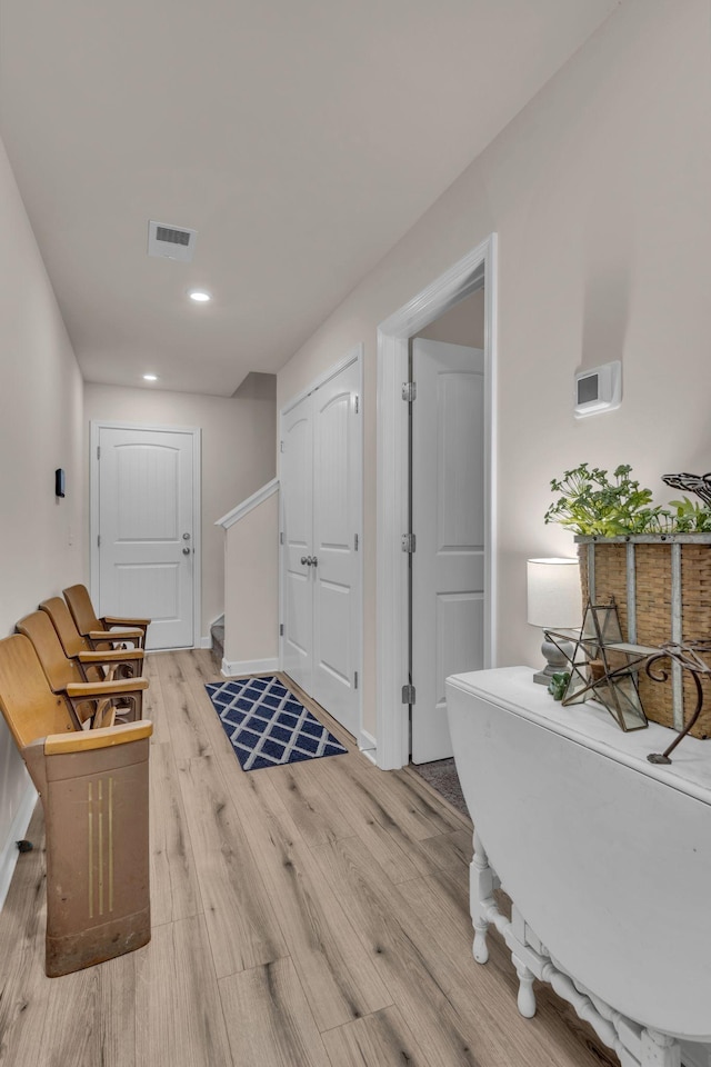 corridor featuring light hardwood / wood-style floors