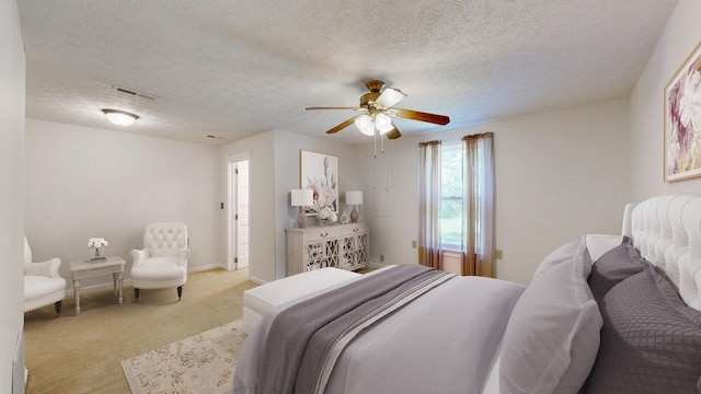 bedroom featuring ceiling fan, light colored carpet, and a textured ceiling