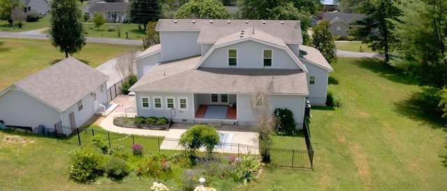 rear view of property featuring a yard