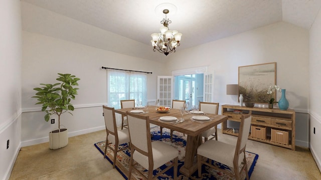 dining space featuring french doors, lofted ceiling, light carpet, and an inviting chandelier