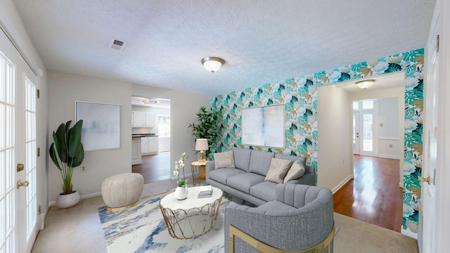 living room with a textured ceiling