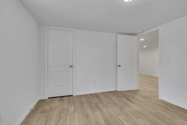 spare room featuring light hardwood / wood-style flooring