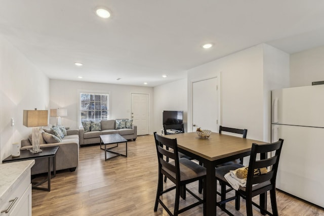 dining area with light wood-type flooring