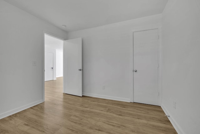 spare room featuring light hardwood / wood-style flooring