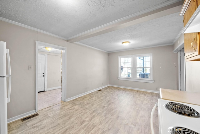 kitchen with a textured ceiling, crown molding, and white appliances