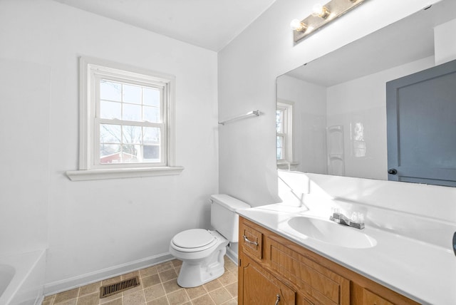 bathroom with toilet and vanity