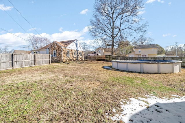 view of yard featuring a covered pool