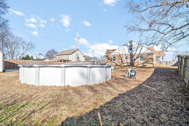 view of yard with a fenced in pool