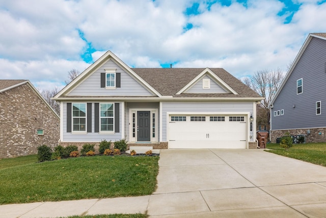 craftsman-style house featuring a front yard and a garage