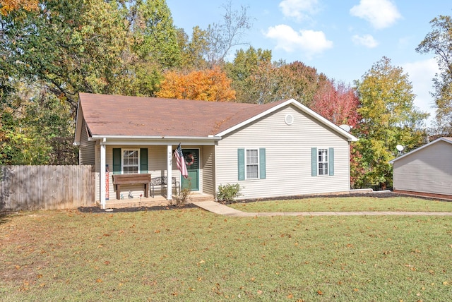 single story home with covered porch and a front yard