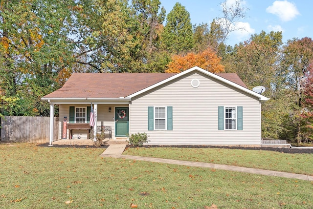 ranch-style house featuring a porch and a front yard