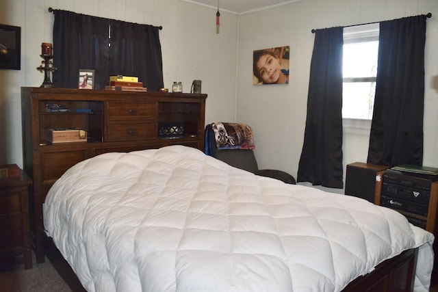 bedroom featuring crown molding