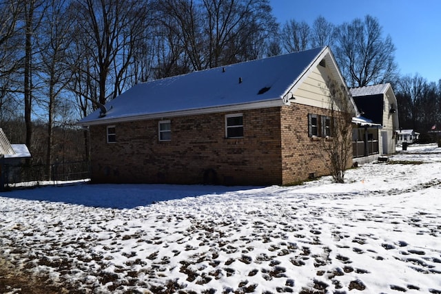 view of snow covered house