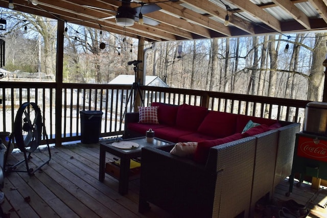 deck featuring ceiling fan and an outdoor hangout area