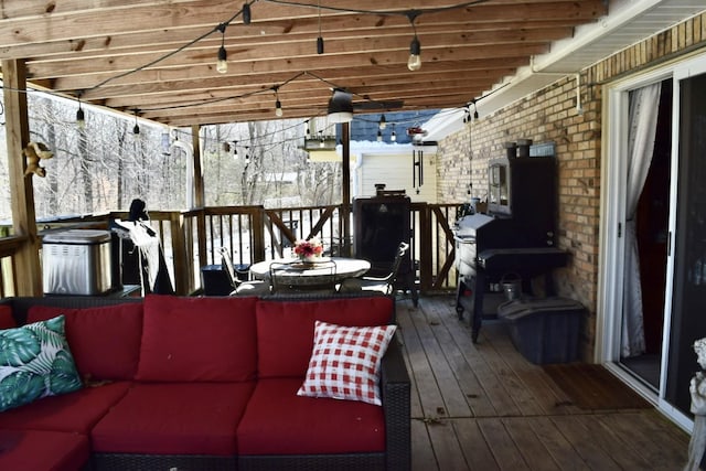 snow covered deck with an outdoor hangout area