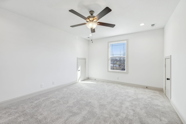 carpeted empty room with ceiling fan