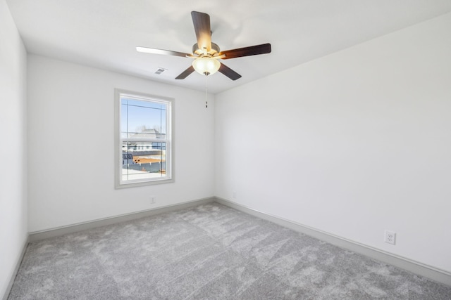 carpeted empty room with ceiling fan