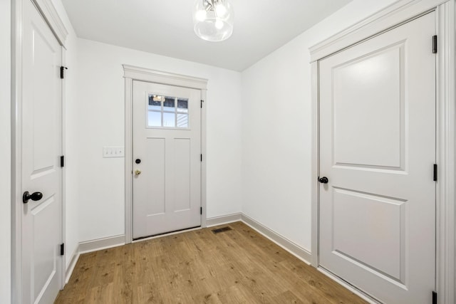 foyer with light hardwood / wood-style flooring