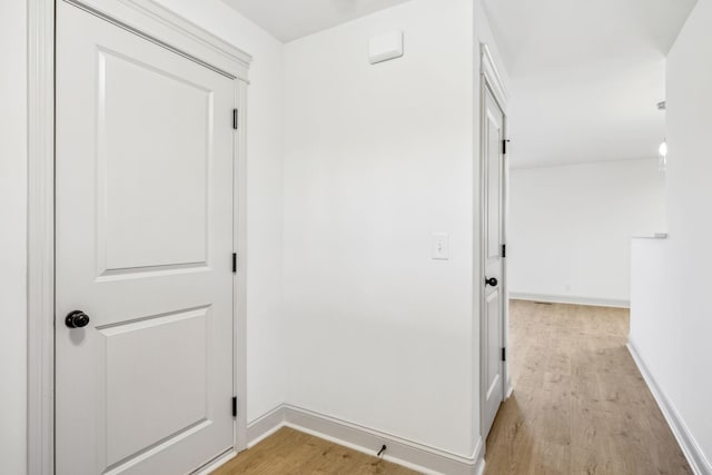 hallway with light wood-type flooring