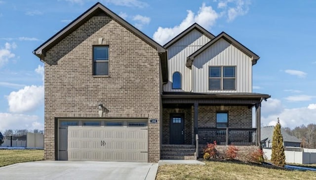 front of property featuring a porch, a garage, and a front lawn