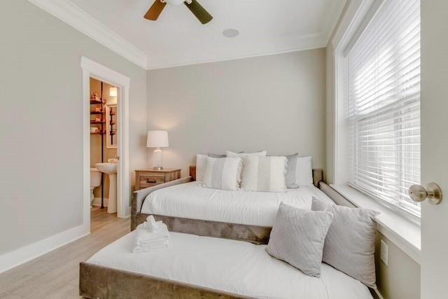 bedroom with ceiling fan, crown molding, and light hardwood / wood-style floors