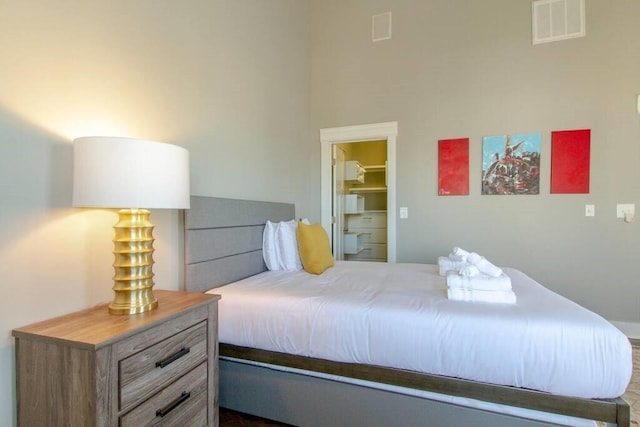 bedroom with a walk in closet