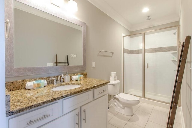 bathroom with vanity, a shower with door, crown molding, tile patterned flooring, and toilet