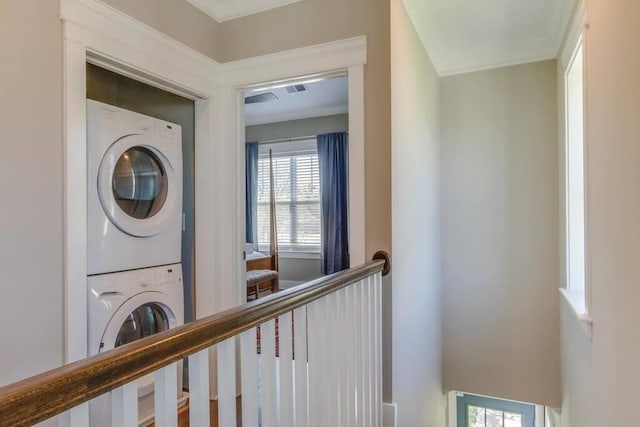 laundry room with stacked washer and clothes dryer