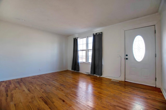 foyer entrance with hardwood / wood-style floors