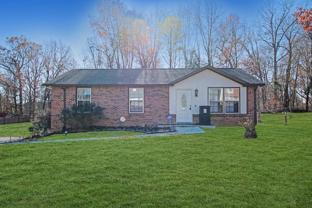 ranch-style house featuring a front yard