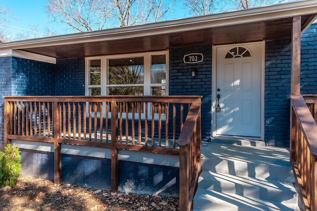 entrance to property with covered porch