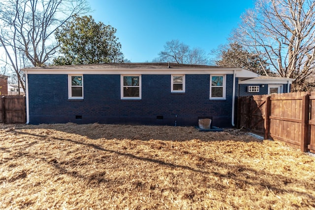 rear view of house with a yard