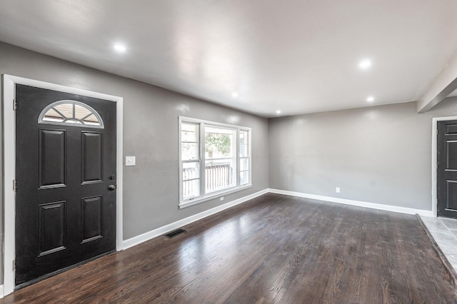 foyer entrance featuring dark wood-type flooring