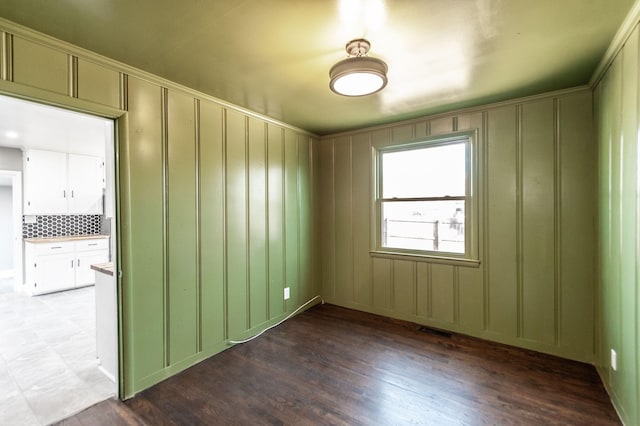 empty room with dark hardwood / wood-style floors