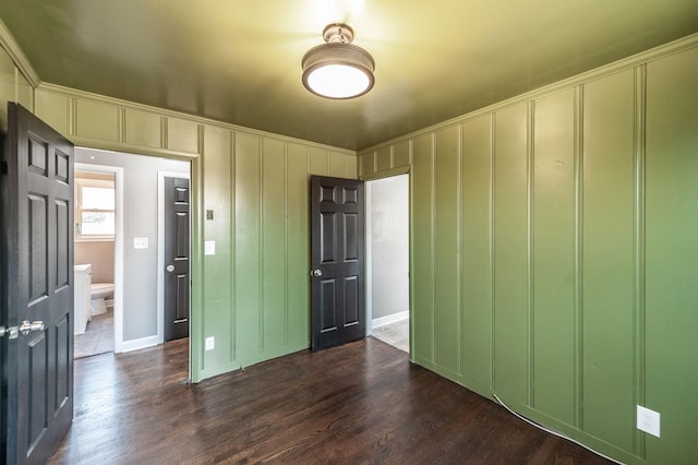 spare room featuring dark hardwood / wood-style flooring