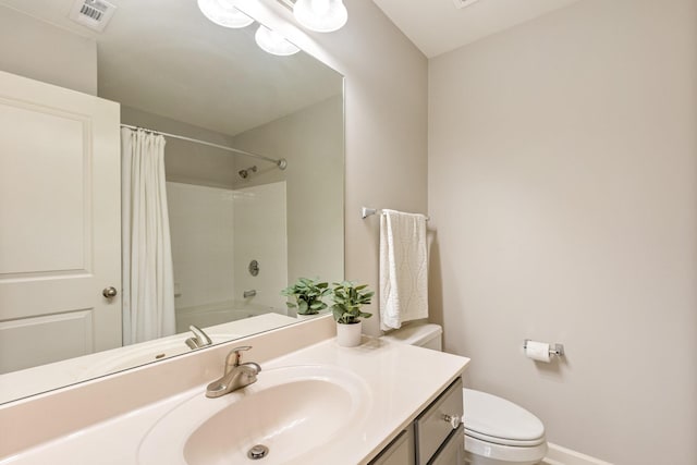 full bathroom with vanity, shower / tub combo, and toilet