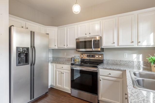 kitchen featuring white cabinetry, appliances with stainless steel finishes, and sink