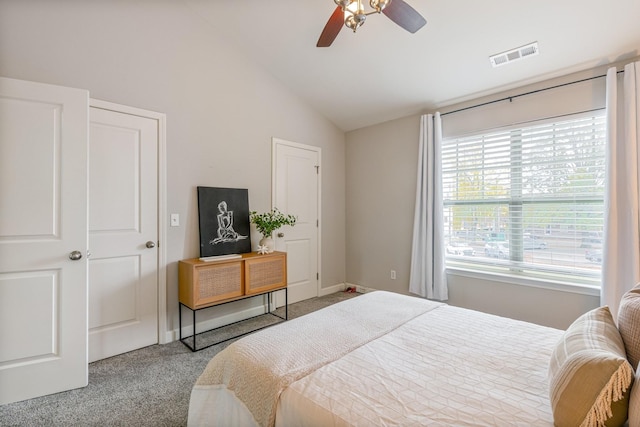 bedroom featuring lofted ceiling, light colored carpet, and ceiling fan