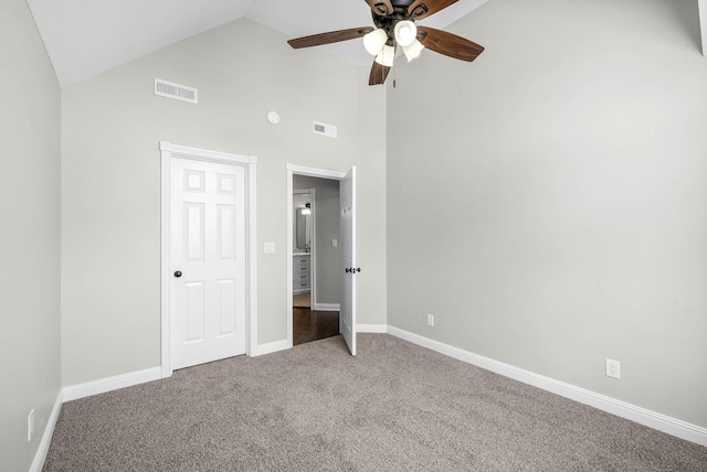 unfurnished bedroom with ceiling fan, carpet, and high vaulted ceiling