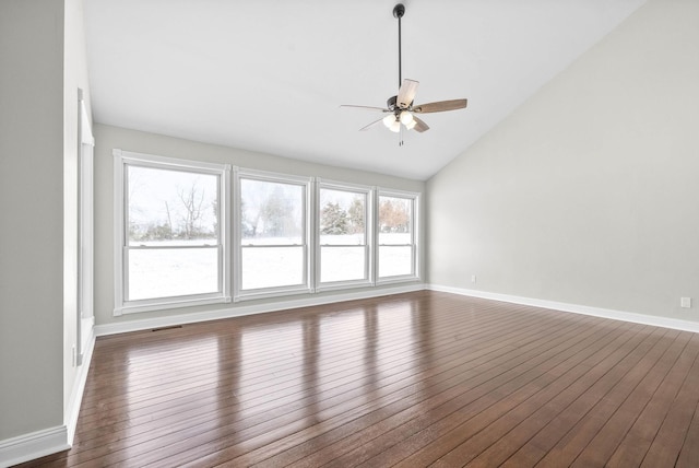 unfurnished room with dark wood-type flooring, lofted ceiling, and ceiling fan